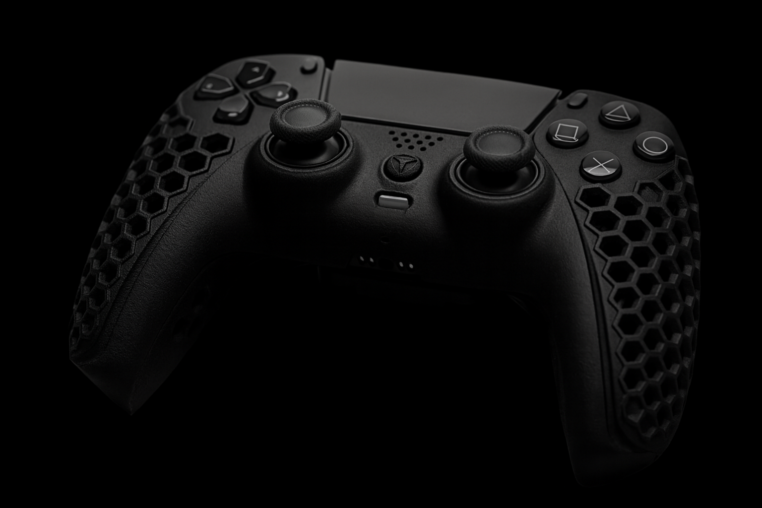 Black gaming controller with textured surface on a black background