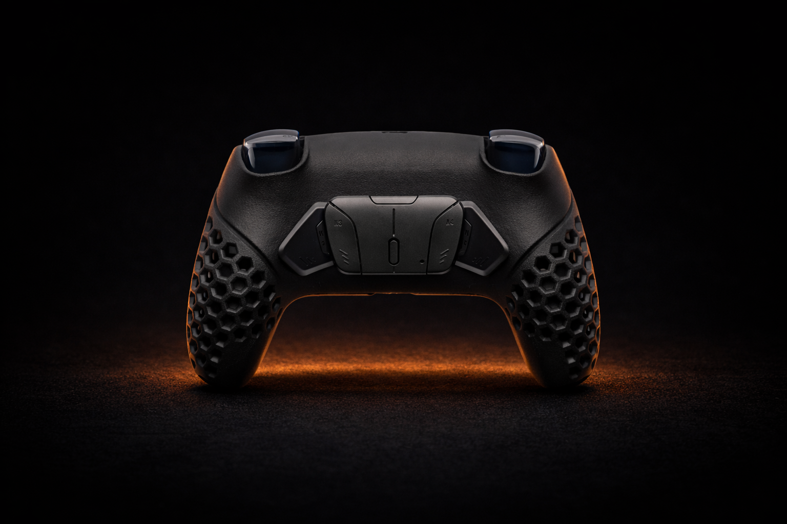 Rear view of the black Helico HexaVent custom controller for PS5 and PC, showcasing four programmable back paddles and ventilated honeycomb grips on a dark background.