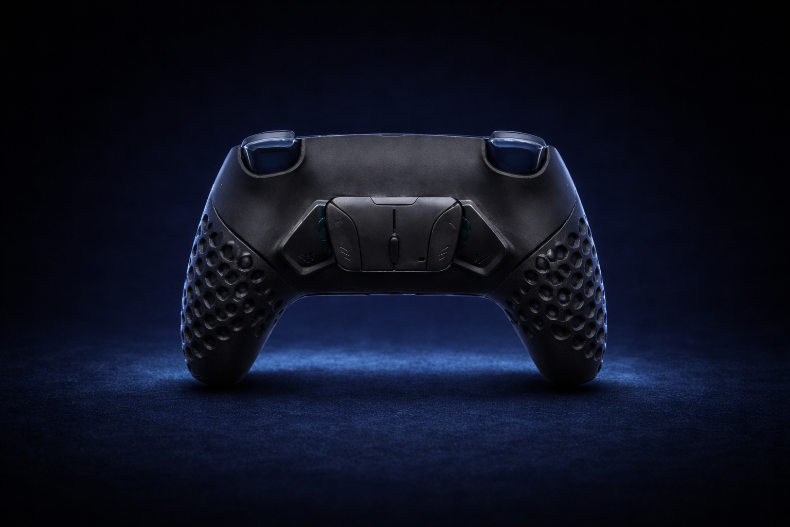 Rear view of the black Helico HexaVent HX-2 custom PS5 and PC controller. Cool blue ambient lighting highlights the programmable back paddles and the signature honeycomb ventilated grips on a dark background.
